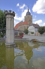 Market fountain and town church of Our Lady built 16th century, water basin, reflection, market,