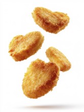 Deep-fried, greasy, breaded chicken nuggets fall onto the background against a white background,