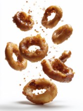 Deep-fried, greasy, squid rings, calamari, fall on the background against a white background,