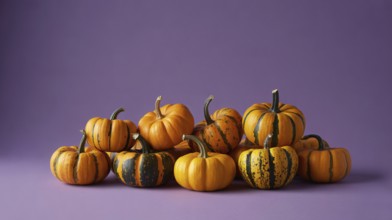 Small orange pumpkins with stripes on purple banner with copy space. Generative ai, AI generated