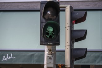 Pumuckel figure in a pedestrian traffic light, Munich, Bavaria, Germany