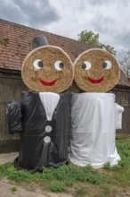 Wedding couple made of straw bales for a wedding celebration, Middle Franconia, Bavaria, Germany