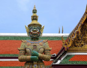 Colorful giant yaksha statue guarding the entrance of wat phra kaew, temple of the emerald buddha,