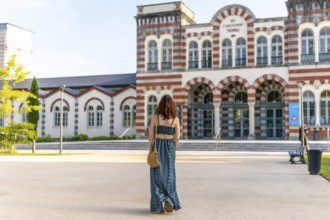 Young woman visiting the famous thermal baths in salies de bearn, a popular spa town in the