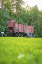 Historic goods wagon in a green setting with summer trees, Nagold, district of Calw, Black Forest,