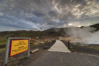 Hot springs, geothermal field, danger sign, cloudy, evening mood, backlight, summer, Krysuvik,