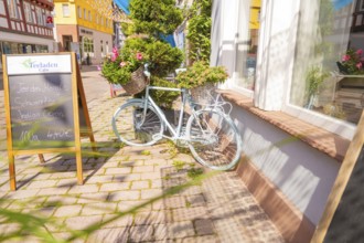 Scenes of a charming street with a pale bicycle and flowers, small town of Perle Calw, district of
