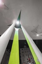 Modern architecture at night with illuminated abstract shapes and acute angles, Munich, Germany