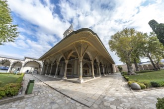 Wide angle view of the decorated audience chamber and the tower of justice, inside the topkapi
