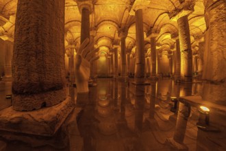 Giant hand sculpture rising from the water surface of the ancient basilica cistern in istanbul,