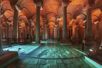 Tourists walking on a walkway in the basilica cistern, a historical landmark in istanbul, turkey,