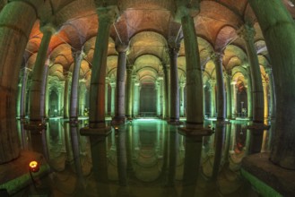 Ancient underground water reservoir with many columns reflecting on the water surface and