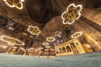 Wide angle view of the interior of the hagia sophia mosque in istanbul, turkey, showing tourists