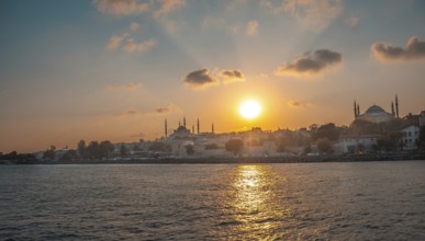 Golden sunset illuminating the historical skyline of istanbul, turkey, featuring the majestic