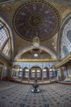 Intricate details and opulent design showcased in the ornately decorated interior of topkapi