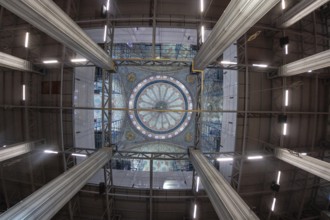 Wide angle view capturing ongoing restoration efforts within a mosque, highlighting scaffolding
