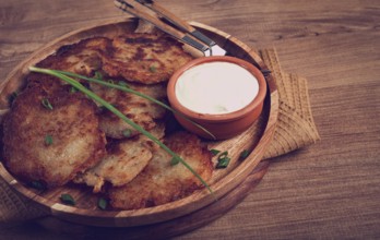 Potato pancakes, pancakes with sour cream, Belarusian dish, homemade, no people