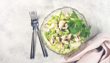 Waldorf salad, celery salad with apple, in a glass salad bowl, natural light, homemade, no people