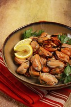 Mussels no shell, boiled, mussels, peeled, in a bowl, with lemon and parsley, Chilean mussels, top