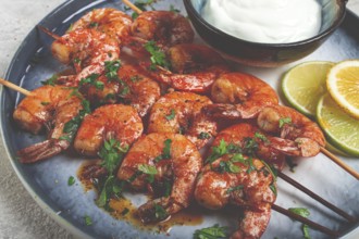 Fried shrimp, without a head, on skewers, shrimp kebabs, with spices, grilled, homemade, without