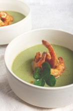 Pea cream soup, with shrimp, green soup, homemade, top view, no people