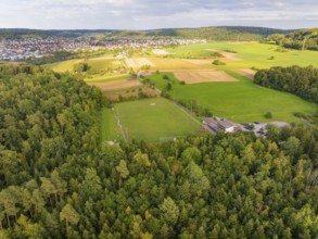 Sports ground next to woods and fields with a view of a village on the horizon, VFL Stammheim,