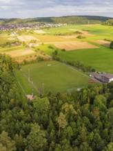 Sports ground surrounded by fields and forest near a housing estate, VFL Stammheim, Calw, Black