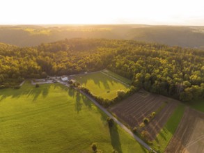 Fields and forest in the light of the sunset with long shadows, VFL Stammheim, Calw, Black Forest,