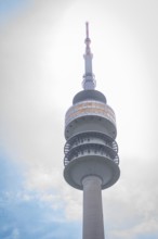 Architecturally striking television tower with spiral structure in front of a cloudy sky, Olympic