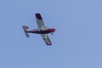 Single-engine aeroplane over Falckenstein, Kiel Fjord, Kiel, Schleswig-Holstein, Germany