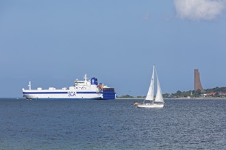 Sailing boat, cargo ship, naval memorial, Laboe, Kiel Fjord, Schleswig-Holstein, Germany