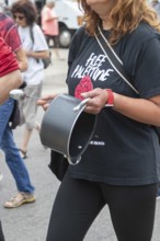 Detroit, Michigan USA - 23 August 2025 - Protesters rally at Eastern Market, banging empty pots to