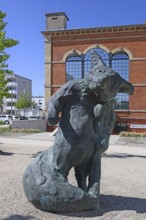 Sculpture by artist Stefan Strumbel in front of his studio, a former, historic boiler house of a