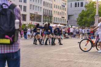 Street dance performance in front of a large crowd in a square in Munich, Munich, Germany