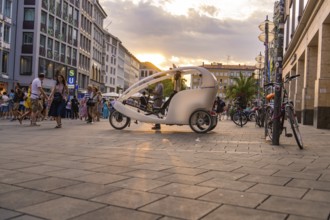Bicycle taxi in Munich city centre at sunset, Munich, Germany