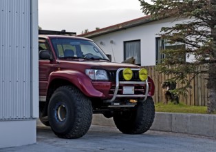 Super Jeep in the driveway, Vopnafjördur, East Iceland, Iceland
