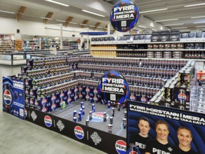 Football stadium built from beverage cans for the European Women's Championship in the supermarket,
