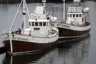 Two small ships in the harbour, Husavik, Iceland