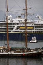 A cruise ship, a sailing ship and other ships and boats in the harbour, Husavik, Iceland