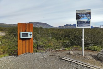 Car park at Brúarfoss waterfall with EC machines for paying in the countryside, South Iceland,