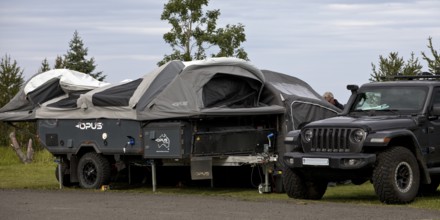 Car with tent trailer at the campsite in Vopnafjördur, East Iceland, Iceland