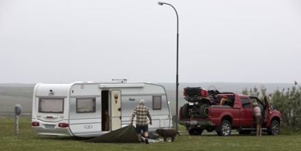 Pick-up with quad bike and caravan at the campsite in Laugarbakki, Northwest Iceland, Iceland