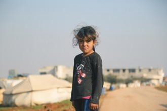 Syrian children living in a temporary refugee camp near the Syrian-Turkish border on World