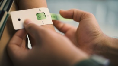 A doctor examines children's malnutrition inside a refugee camp. Malnutrition was measured using a