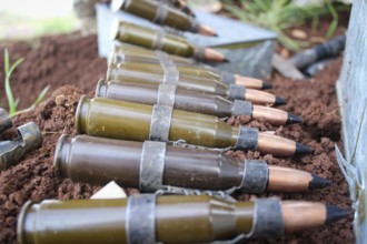 Syrian armed opposition fighters preparing ammunition during combat against ISIS. Aleppo, Syria