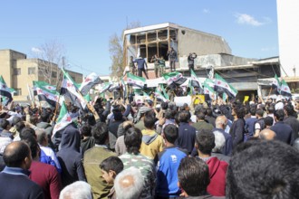 Civilians demonstrating in support of the Syrian revolution against the Bashar al-Assad regime.