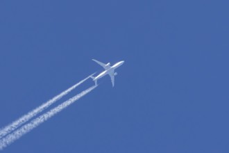 Boeing 787 Dreamliner jet passenger aircraft of KLM Royal Dutch airlines with a vapour trail or