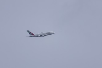 Airbus A380 jet passenger aircraft of Emirates airlines flying, England, United Kingdom