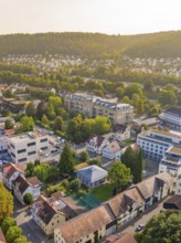 Panorama of a quiet town with green hills and numerous houses in a sunny atmosphere, Nagold,