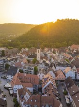 Aerial view of an old town with church, surrounded by hills and sunset, Nagold, district of Calw,